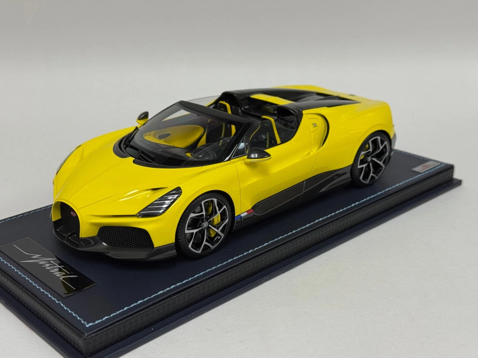 1/18 MR Collection Bugatti W16 Mistral in Yellow on leather base BUG015B