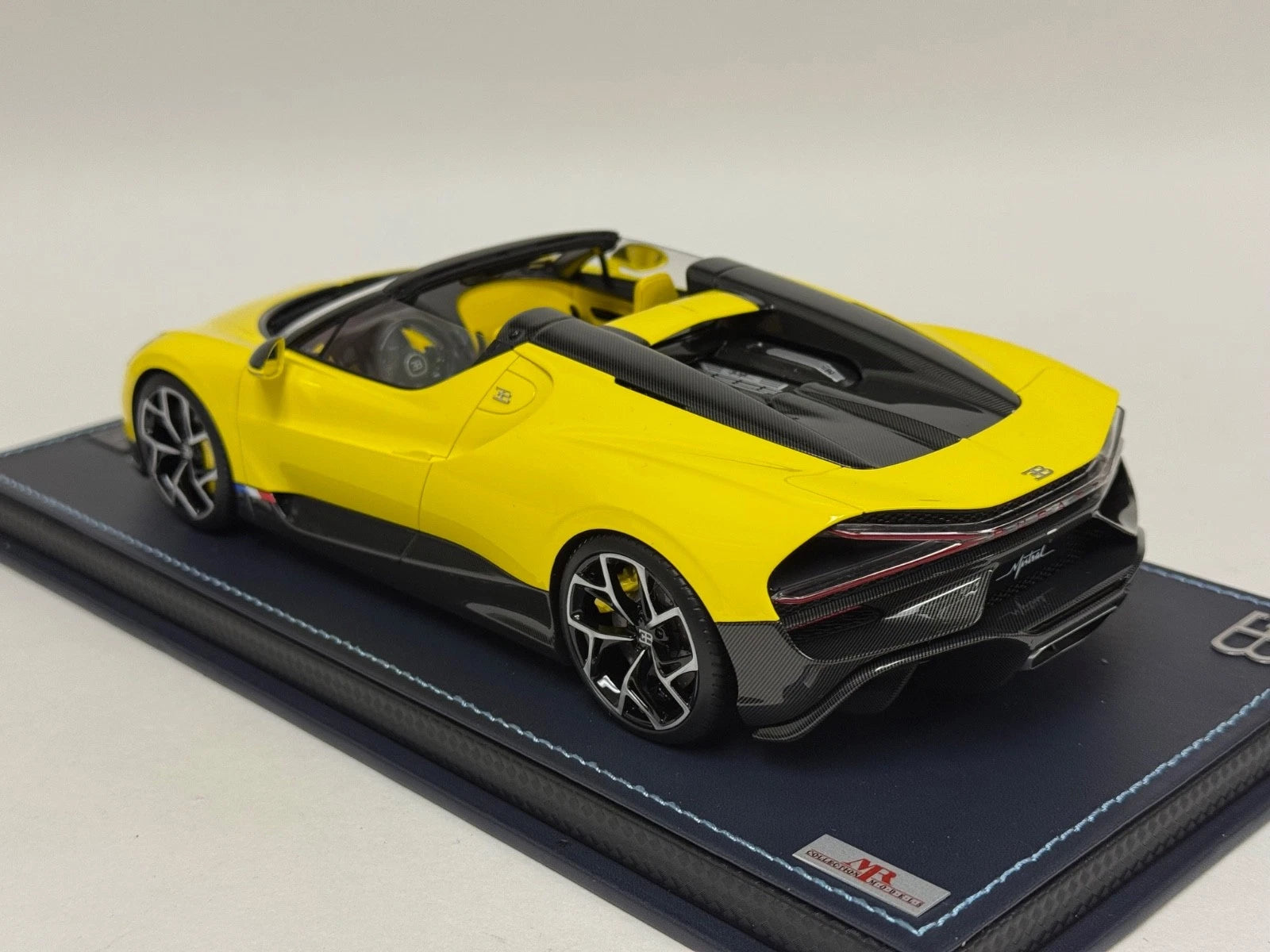 1/18 MR Collection Bugatti W16 Mistral in Yellow on leather base BUG015B