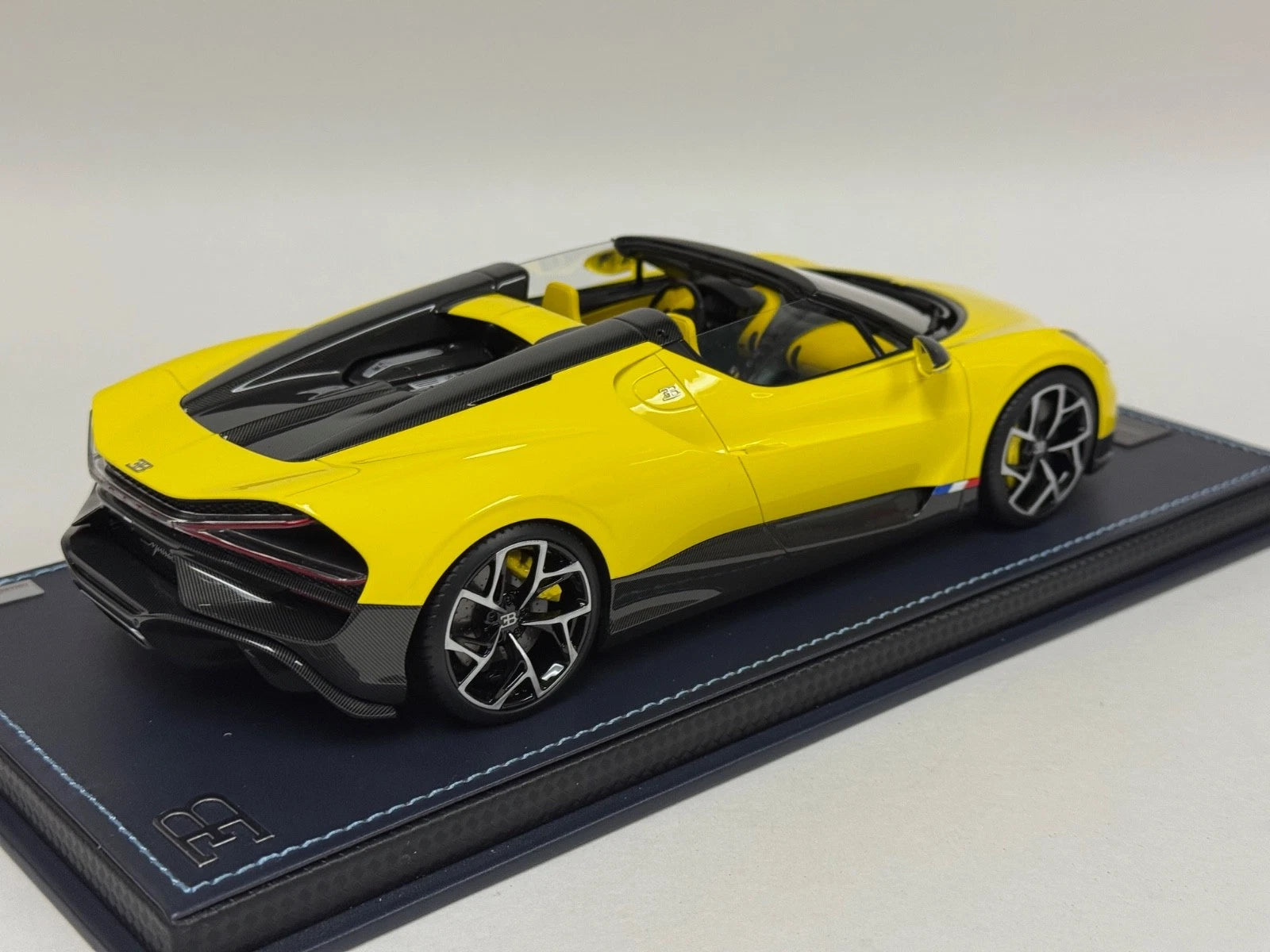 1/18 MR Collection Bugatti W16 Mistral in Yellow on leather base BUG015B