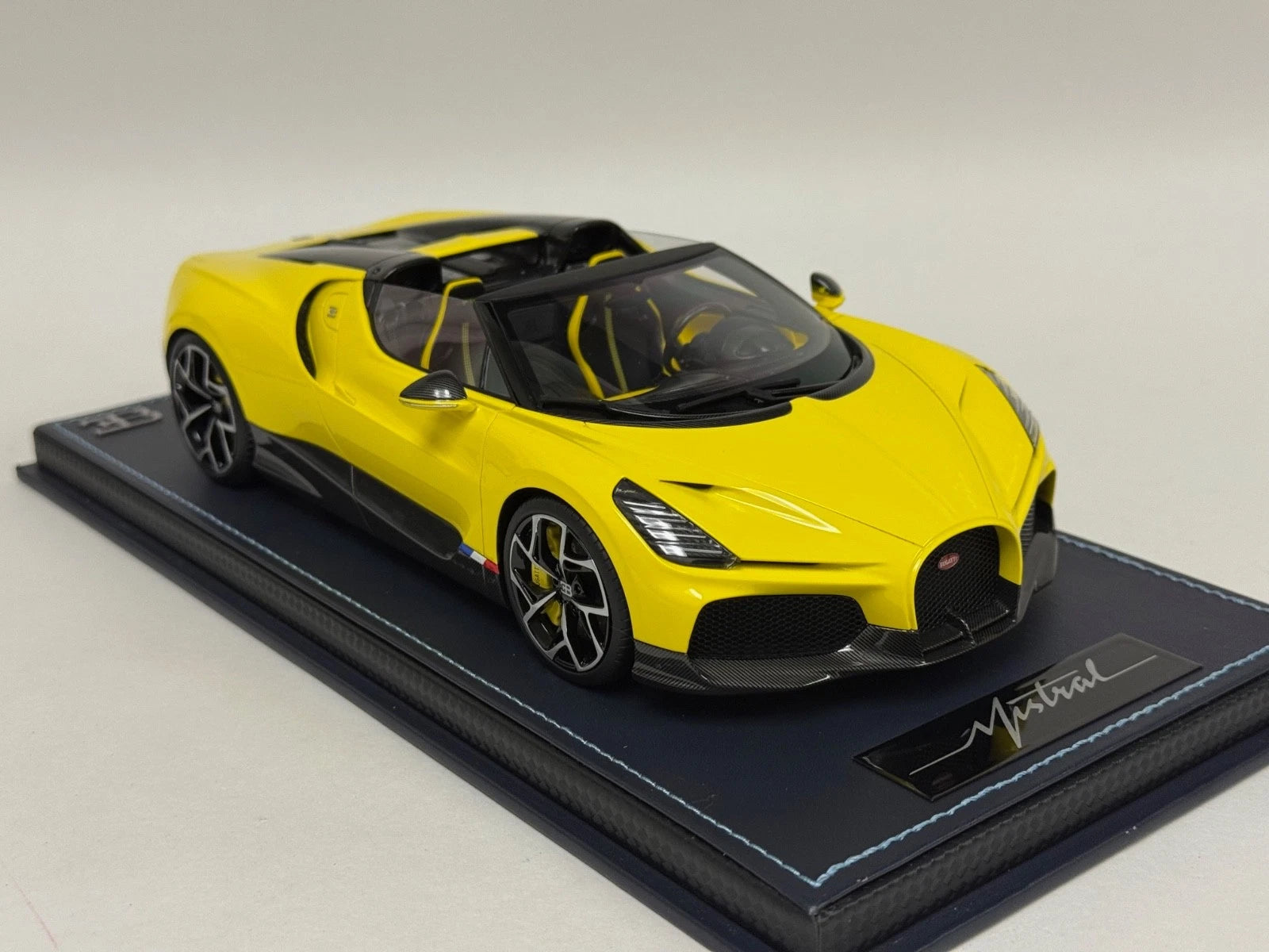 1/18 MR Collection Bugatti W16 Mistral in Yellow on leather base BUG015B
