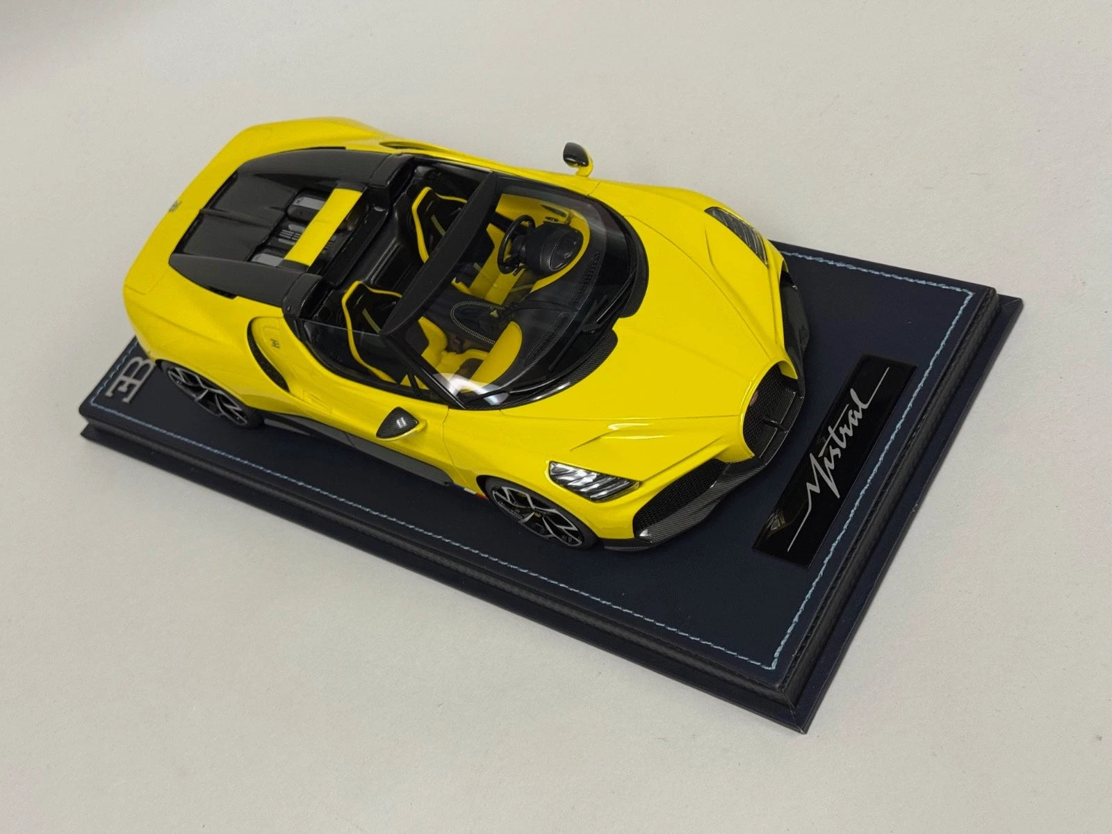1/18 MR Collection Bugatti W16 Mistral in Yellow on leather base BUG015B