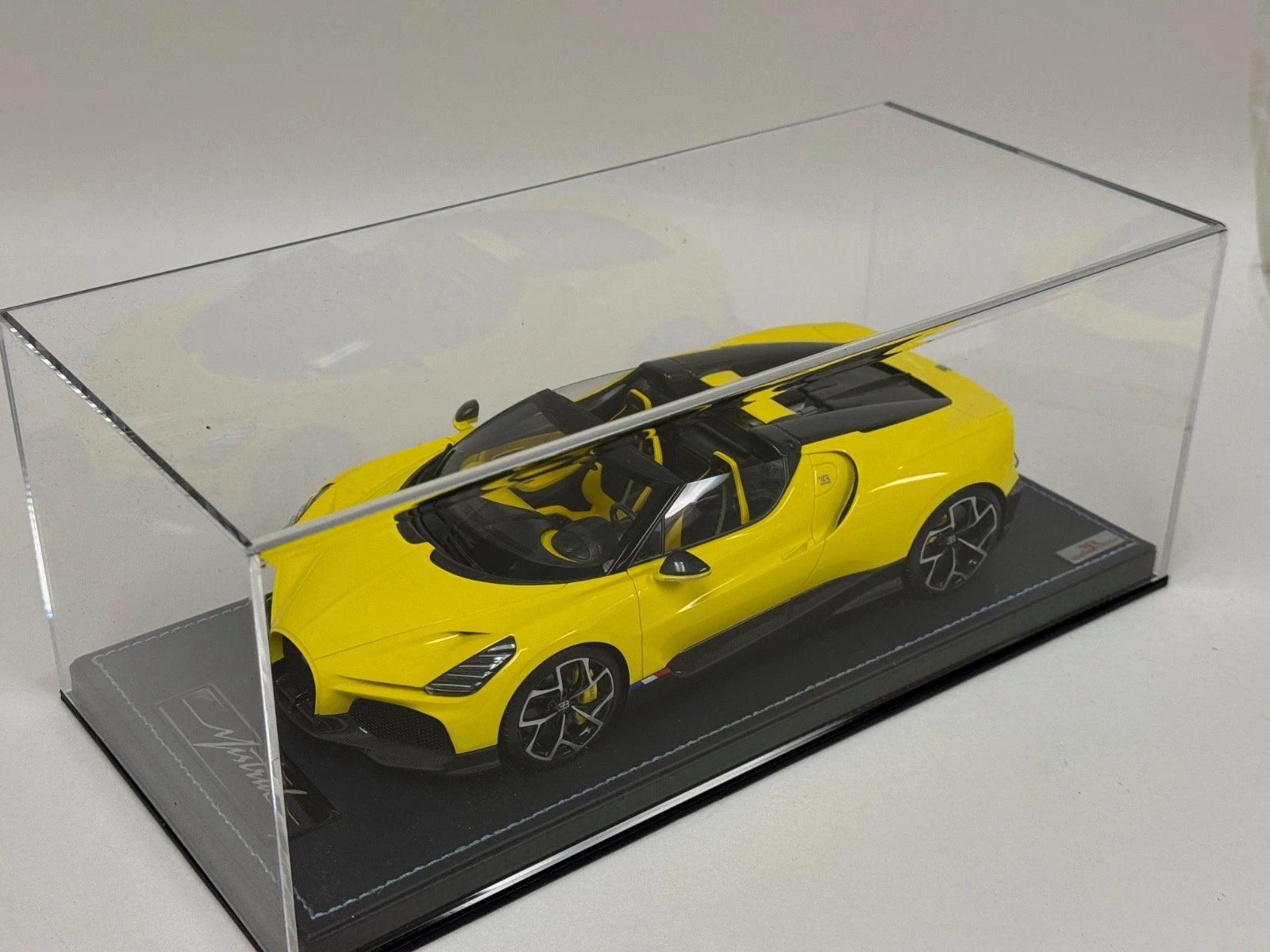 1/18 MR Collection Bugatti W16 Mistral in Yellow on leather base BUG015B